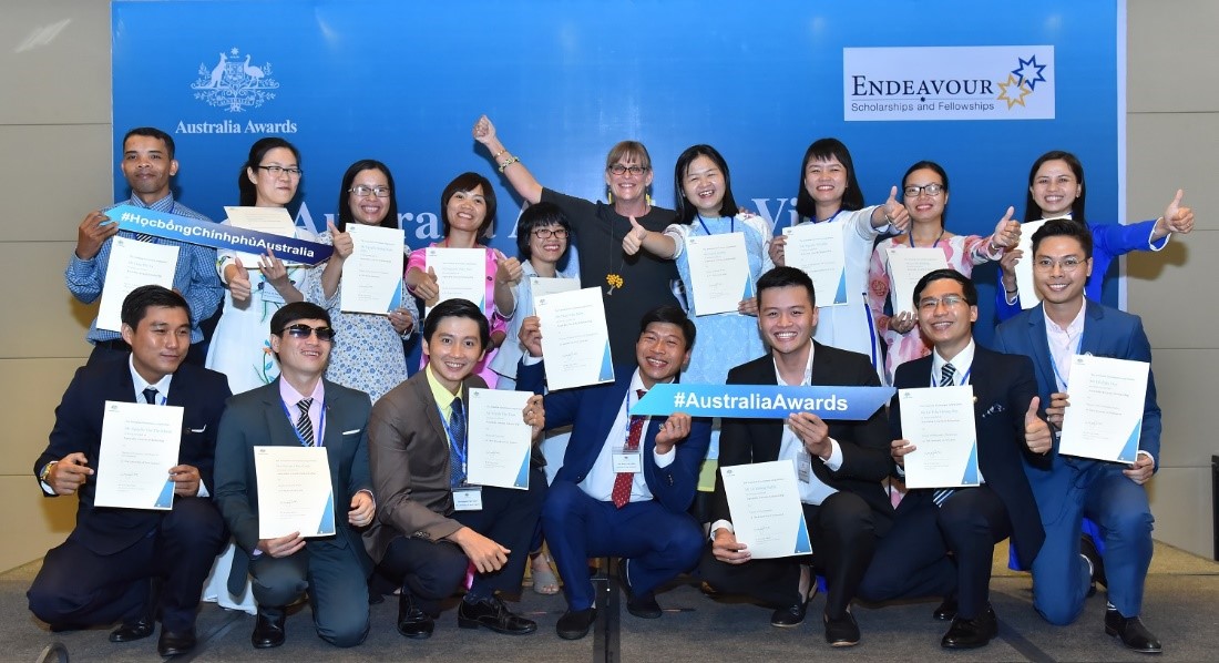 Australia Awards Scholarship recipients in a group photo with Ms Karen Lanyon